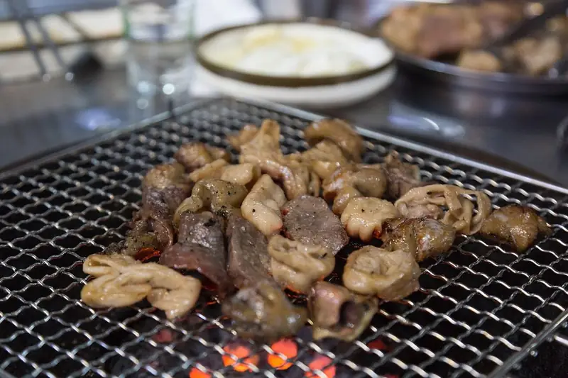 Gopchang and makchang beef intestines grilling over charcoal